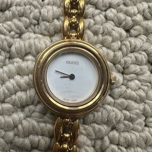 Gucci Gold Timepiece with White Face